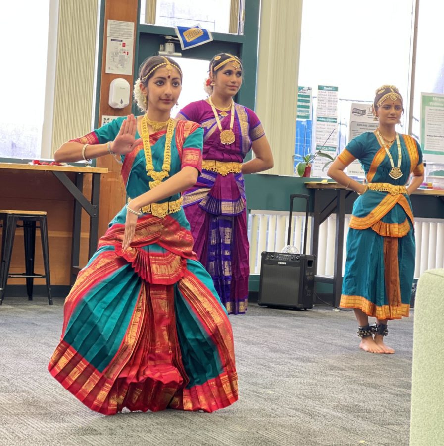 Students Gia Chhabra and Trisha Prabandham participate in a dance led by the Kalanjali Dances of India group. Photo: Emma Wong